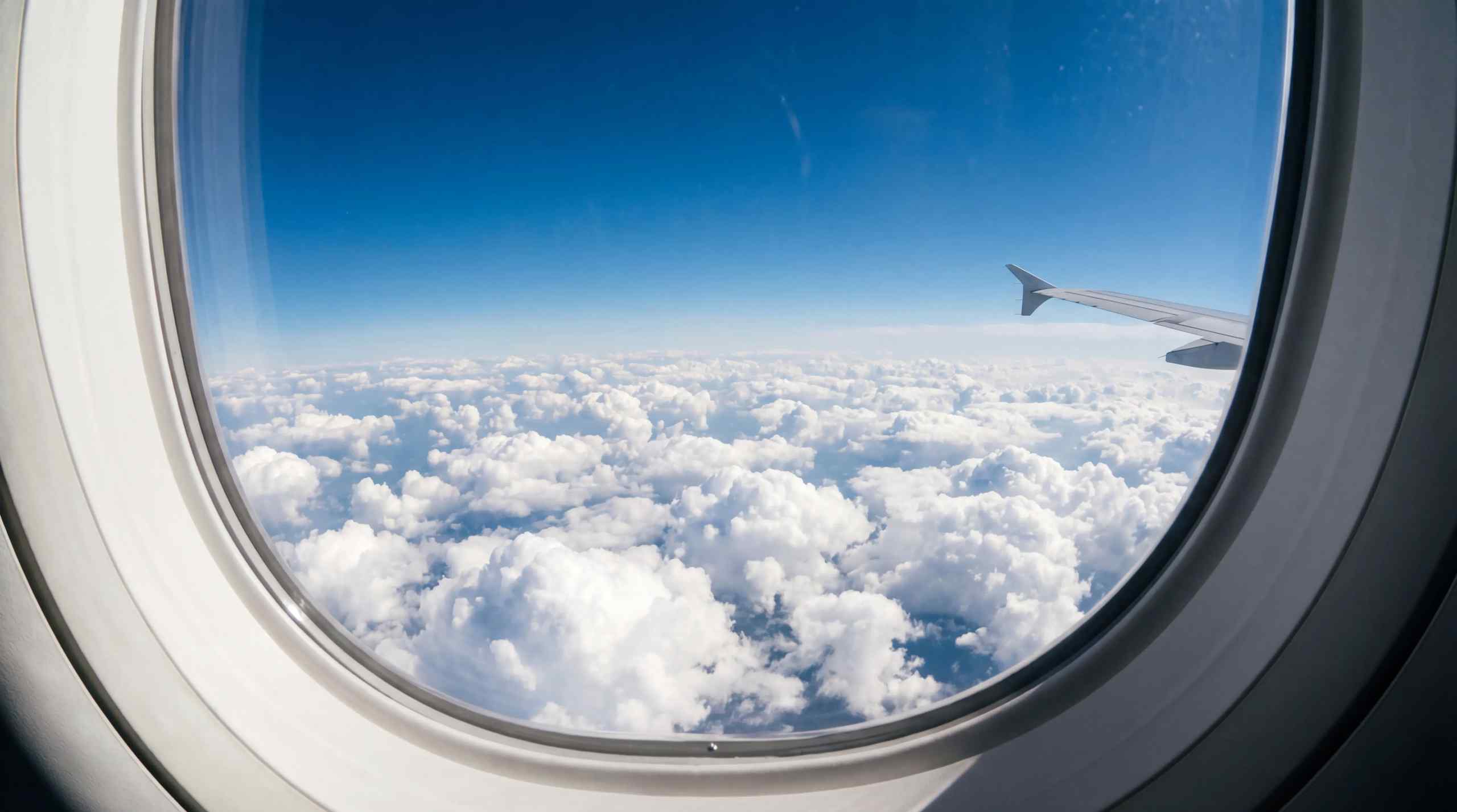 The view outside a jet window while in the sky.